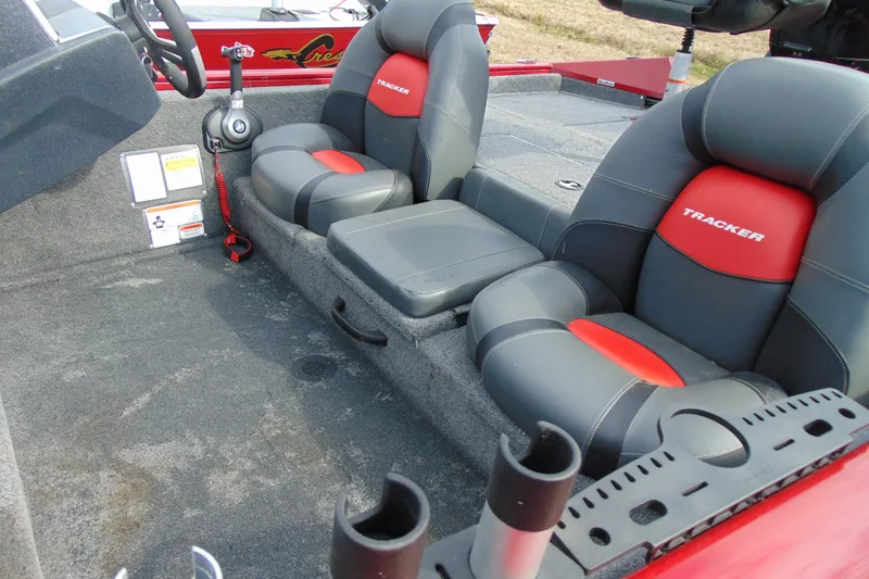 Slide: The Image of 2024 Tracker Pro Team 175 TF boat interior with gray and red seating. - 7