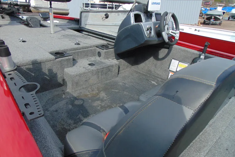 Slide: The Image of 2024 Tracker Pro Team 175 TF boat interior with steering console and seating. - 9