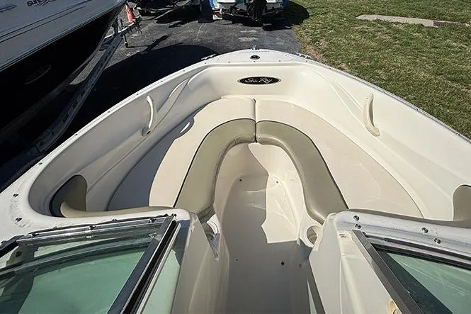 Slide: The Image of 2004 Sea Ray 185 Sport boat interior with seating and open bow design. - 15