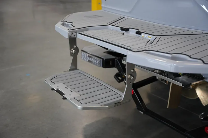 Slide: The Image of 2025 MasterCraft XT23 swim platform with foldable step, showcasing modern design and functionality. - 16