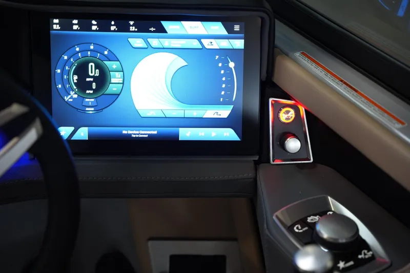 Slide: The Image of 2025 MasterCraft XT23 dashboard with digital display and control panel. - 7