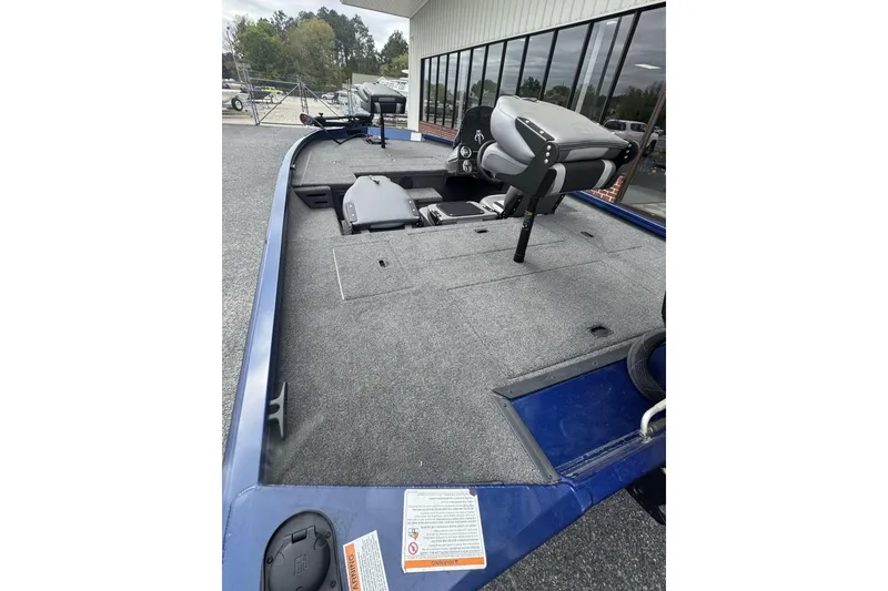 Slide: The Image of 2024 Lowe Stinger 175C fishing boat with spacious deck and seating. - 10