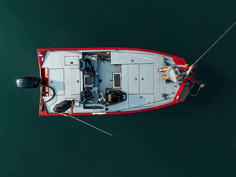 Slide: The Image of Manufacturer Provided Image: 2024 Lowe Stinger 175C fishing boat on water, top view. - 13