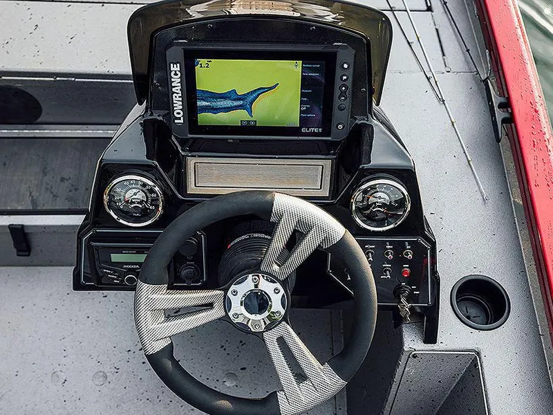 Slide: The Image of Manufacturer Provided Image: 2024 Lowe Stinger 175C boat dashboard with Lowrance fishfinder and steering wheel. - 14