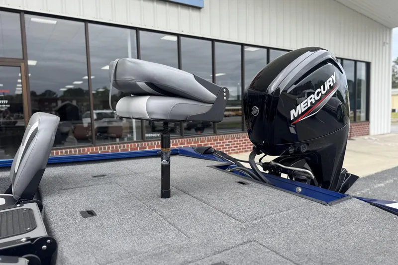 Slide: The Image of 2024 Lowe Stinger 175C boat with Mercury outboard motor and seating. - 3