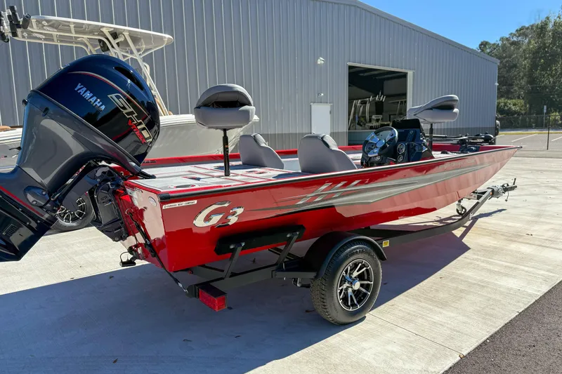 Slide: The Image of 2026 G3 Sportsman 1710 SE boat with Yamaha engine, parked outdoors. - 3