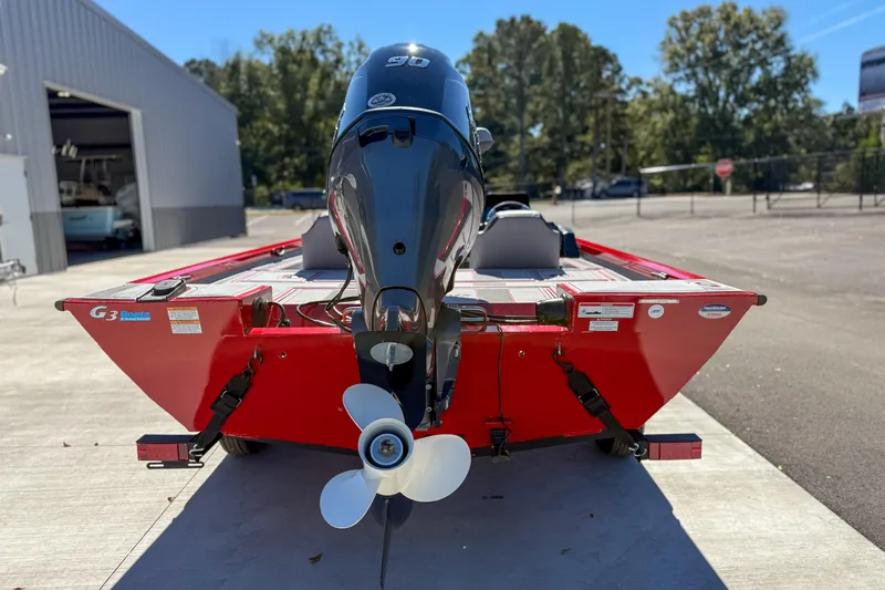 Slide: The Image of 2026 G3 Sportsman 1710 SE boat, red exterior, parked outdoors near a building. - 4