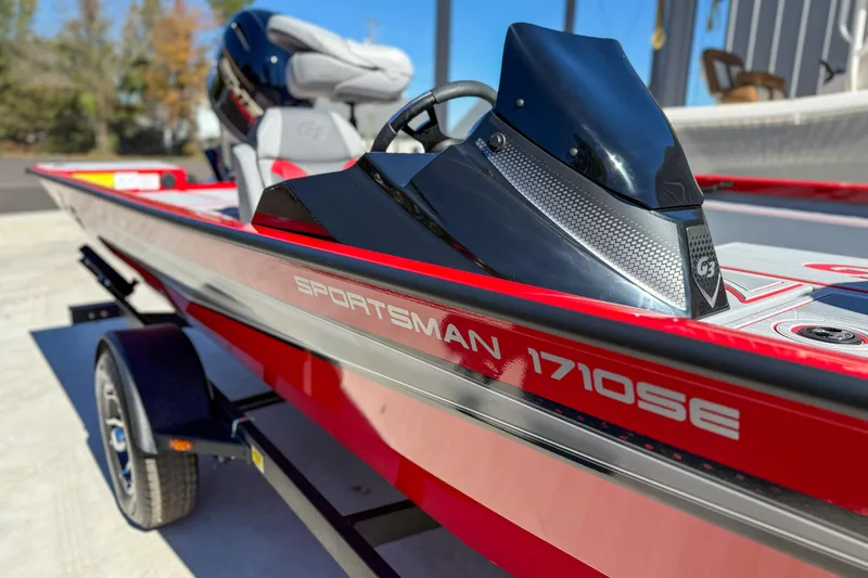 Slide: The Image of 2026 G3 Sportsman 1710 SE boat, red and black design, parked on trailer. - 5