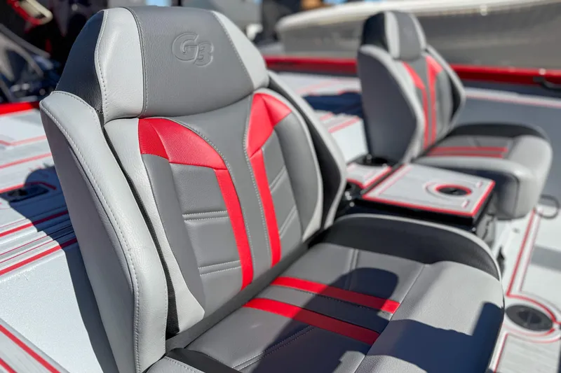 Slide: The Image of 2026 G3 Sportsman 1710 SE boat seats with red and gray upholstery. - 8
