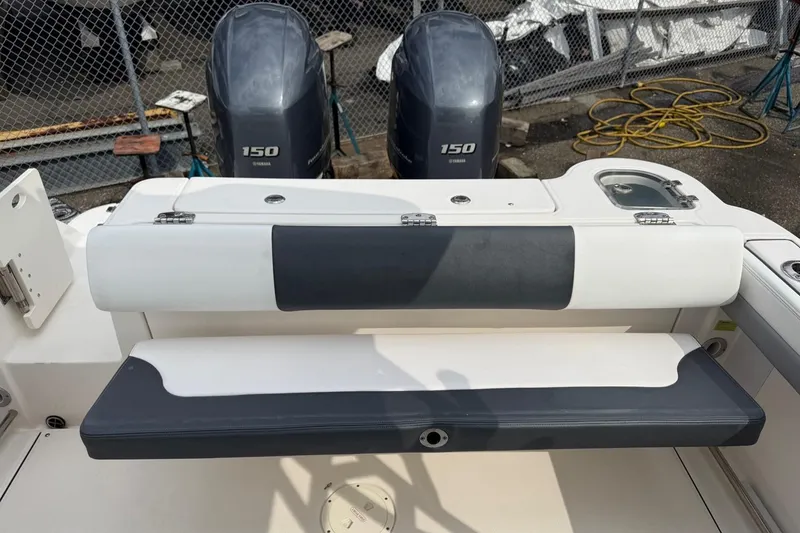 Slide: The Image of 2021 Robalo R247 Dual Console boat with dual 150 horsepower engines. - 13