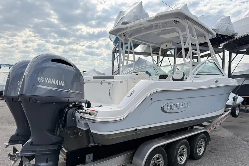 Slide: The Image of 2021 Robalo R247 Dual Console boat with Yamaha engines on a trailer. - 3