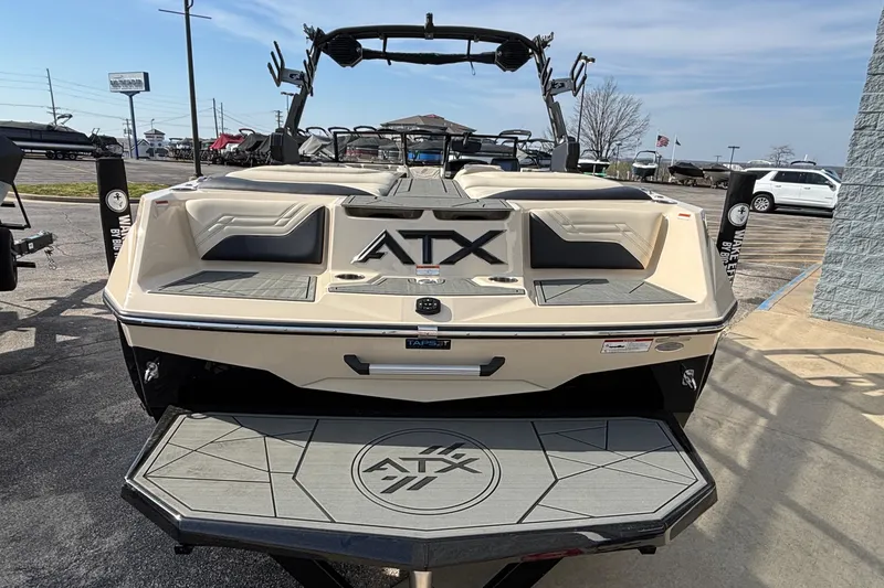 Slide: The Image of 2026 ATX Surf Boats 24 Type-S, rear view, showcasing sleek design and branding. - 10