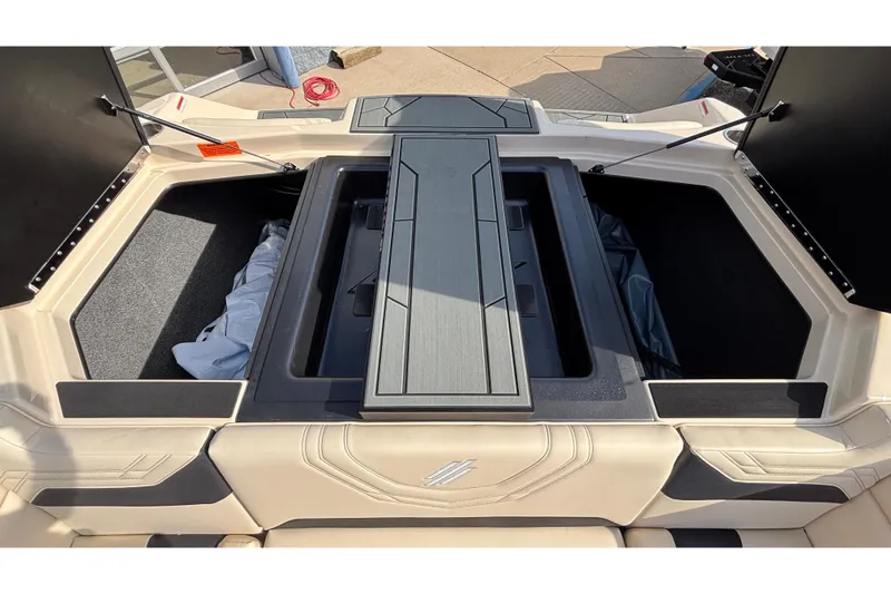 Slide: The Image of 2026 ATX Surf Boats 24 Type-S storage compartments with open hatches and seating area. - 16
