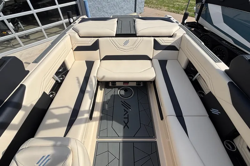 Slide: The Image of Interior of 2026 ATX Surf Boats 24 Type-S with beige and black seating. - 19