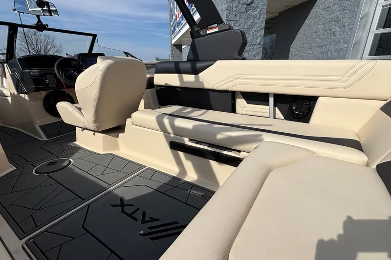 Slide: The Image of Interior of 2026 ATX Surf Boats 24 Type-S with beige seating and modern dashboard. - 22