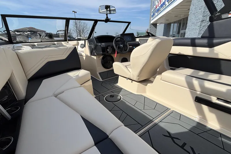 Slide: The Image of 2026 ATX Surf Boats 24 Type-S interior with beige and black seating, modern dashboard. - 23
