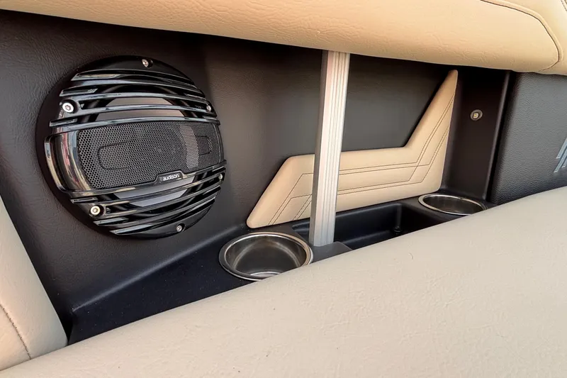 Slide: The Image of 2026 ATX Surf Boats 24 Type-S interior with speaker and cup holders. - 24