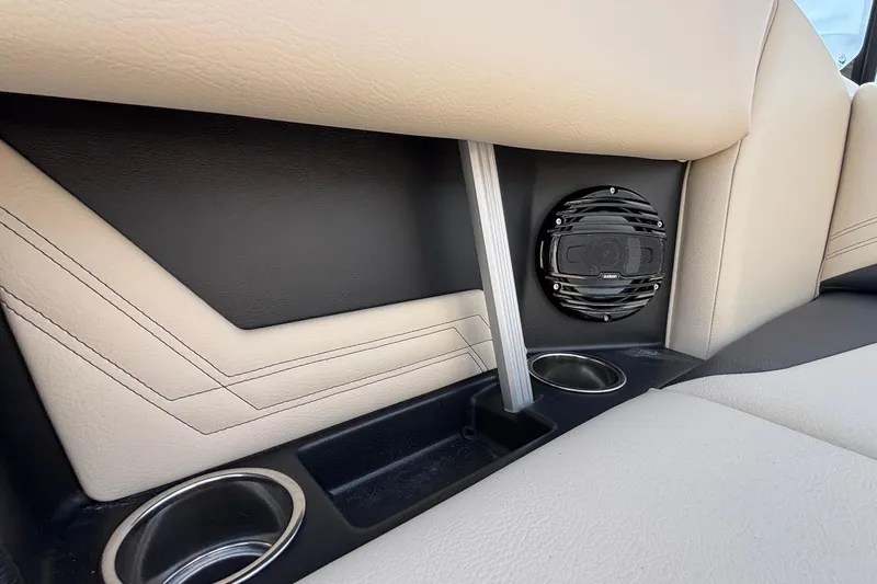 Slide: The Image of Interior of 2026 ATX Surf Boats 24 Type-S, featuring speaker and cup holders. - 26