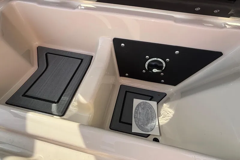 Slide: The Image of Interior view of 2026 ATX Surf Boats 24 Type-S, featuring storage compartments. - 28