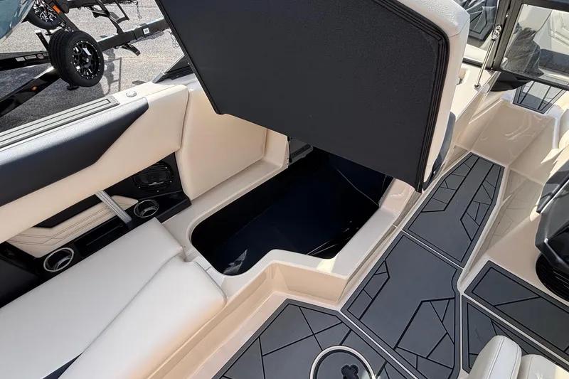 Slide: The Image of 2026 ATX Surf Boats 24 Type-S interior with open storage compartment and stylish seating. - 29