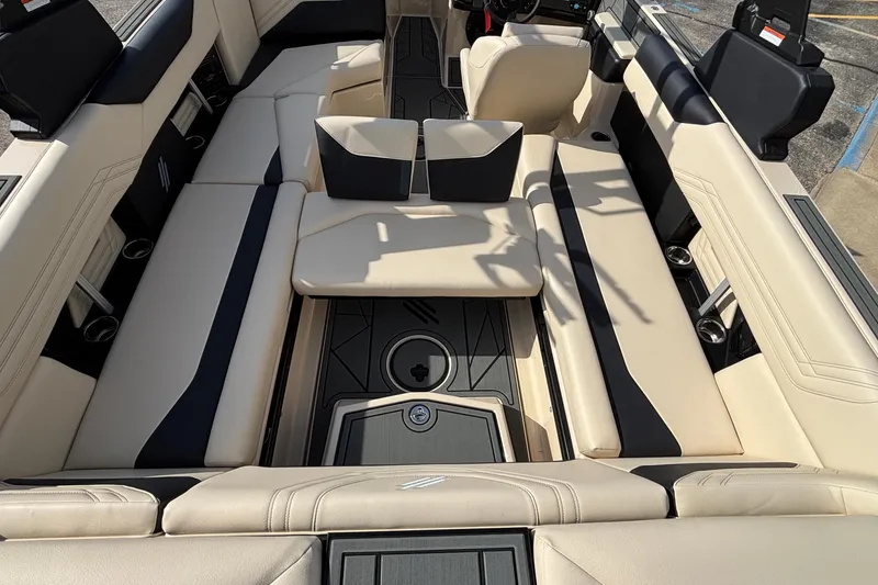 Slide: The Image of Luxurious interior of 2026 ATX Surf Boats 24 Type-S with beige and black seating. - 33