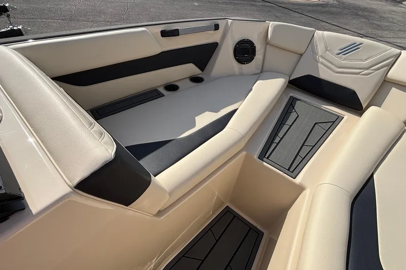 Slide: The Image of Luxurious interior of 2026 ATX Surf Boats 24 Type-S with beige and black seating. - 38