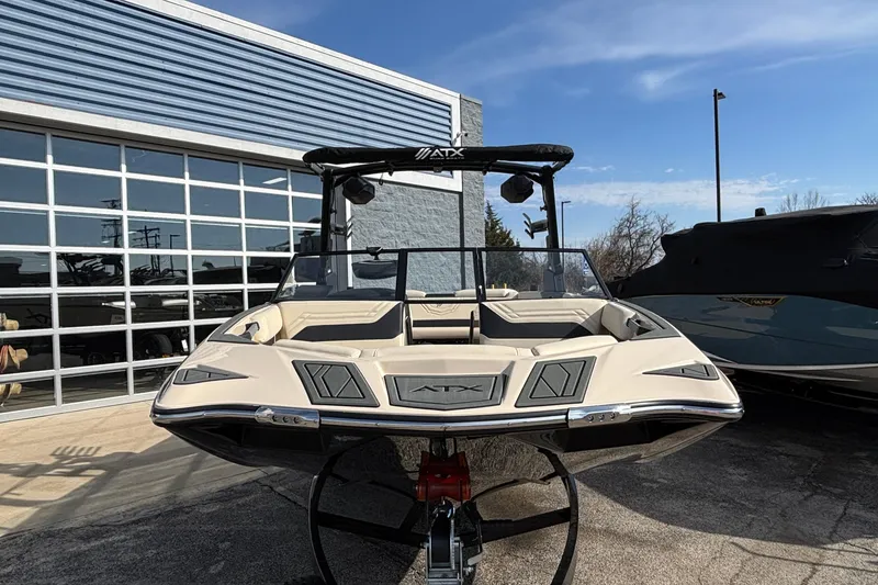 Slide: The Image of 2026 ATX Surf Boats 24 Type-S, sleek design, parked outdoors, sunny day. - 4