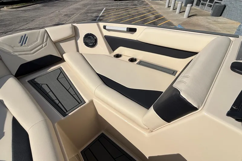 Slide: The Image of Luxurious interior of 2026 ATX Surf Boats 24 Type-S with beige and black seating. - 40