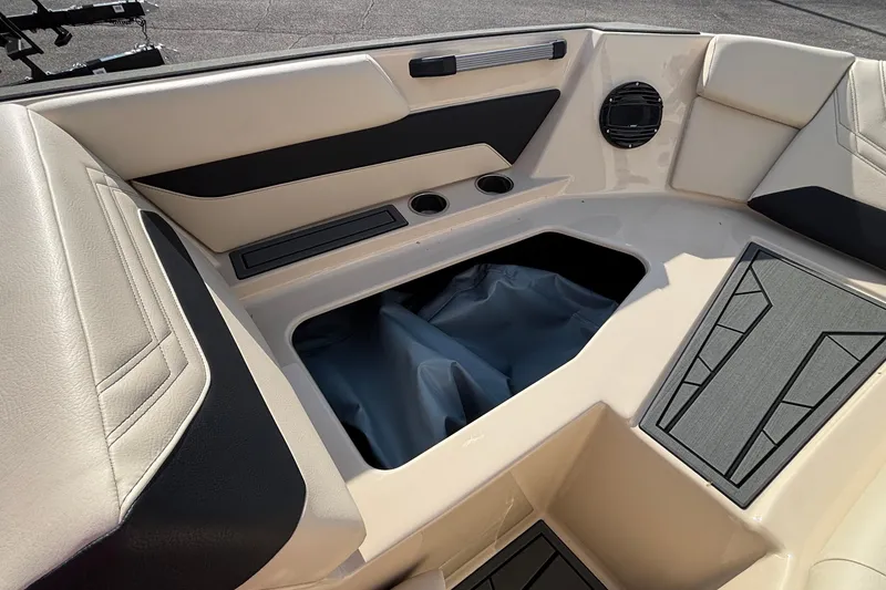 Slide: The Image of Interior view of 2026 ATX Surf Boats 24 Type-S, featuring storage compartment and seating. - 41