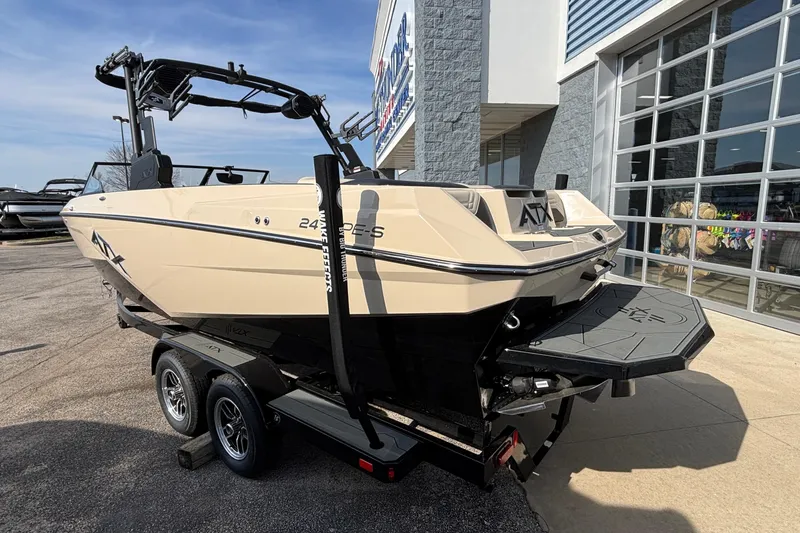 Slide: The Image of 2026 ATX Surf Boats 24 Type-S on trailer outside dealership. - 47