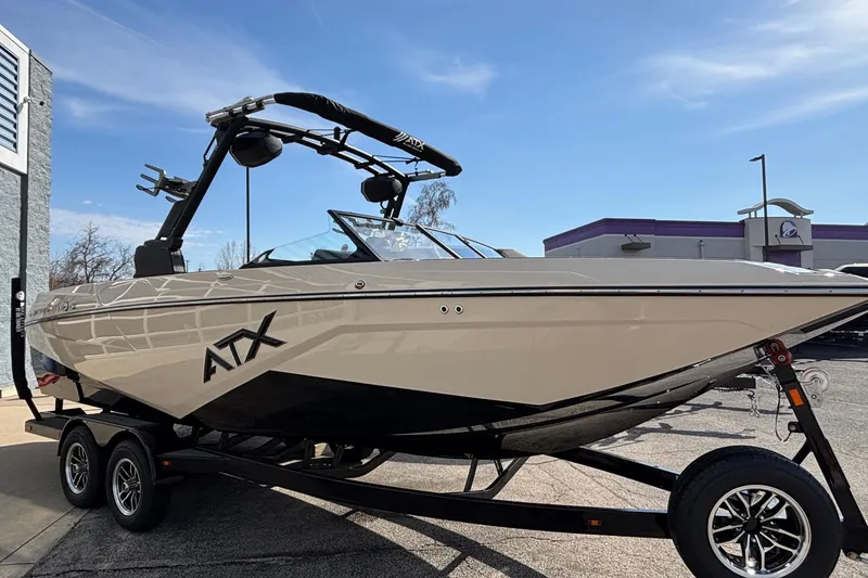 Slide: The Image of 2026 ATX Surf Boats 24 Type-S on trailer, parked outdoors under clear sky. - 6