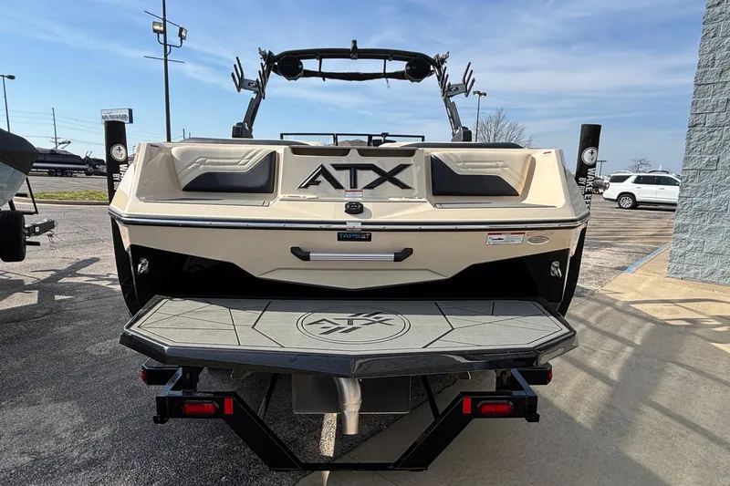 Slide: The Image of 2026 ATX Surf Boats 24 Type-S, rear view, parked outdoors on a sunny day. - 9