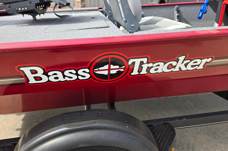 Slide: The Image of 2022 Tracker Bass Tracker Classic XL boat logo on red exterior. - 11