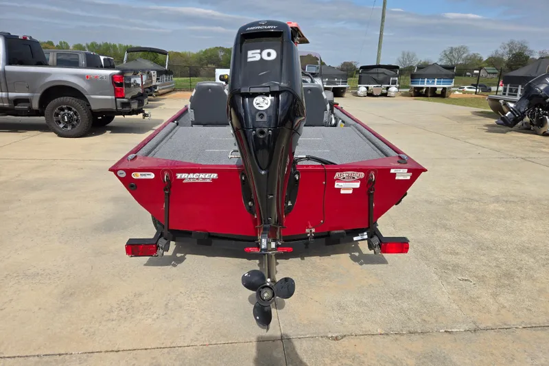 Slide: The Image of 2022 Tracker Bass Tracker Classic XL boat with Mercury 50 engine, parked outdoors. - 4
