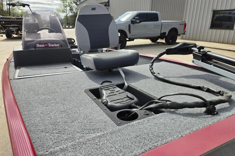 Slide: The Image of 2022 Tracker Bass Tracker Classic XL boat interior with seating and controls. - 8