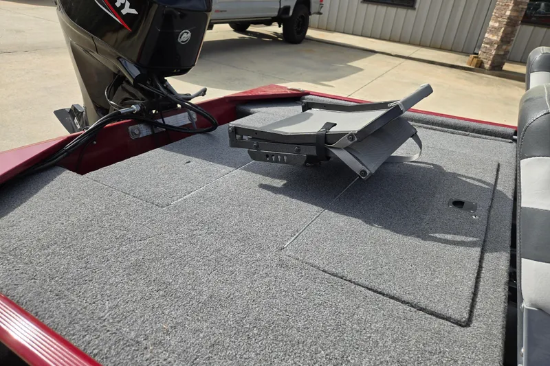 Slide: The Image of 2022 Tracker Bass Tracker Classic XL boat deck with folded seat and Mercury engine. - 9