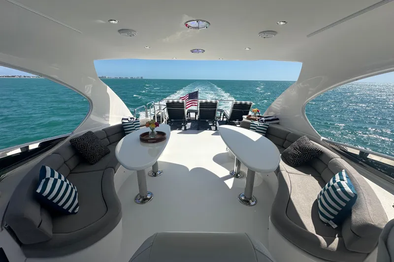 Slide: The Image of Luxurious 2006 Lazzara 68 Motoryacht deck with elegant seating and ocean view. - 18