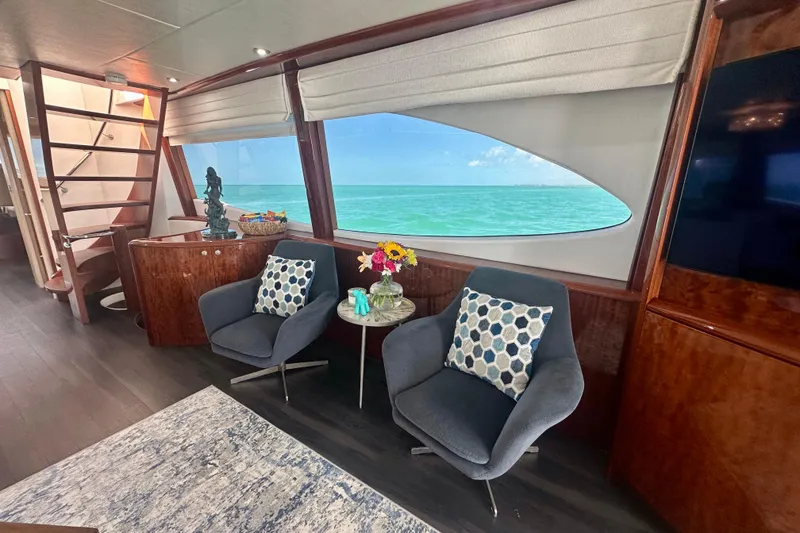 Slide: The Image of Luxurious interior of 2006 Lazzara 68 Motoryacht with ocean view and modern seating. - 26