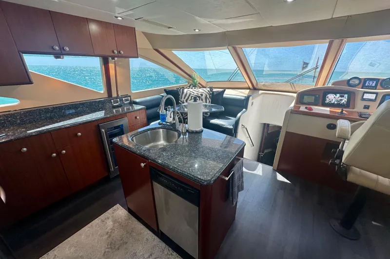 Slide: The Image of Luxurious interior of 2006 Lazzara 68 Motoryacht with modern kitchen and helm. - 35