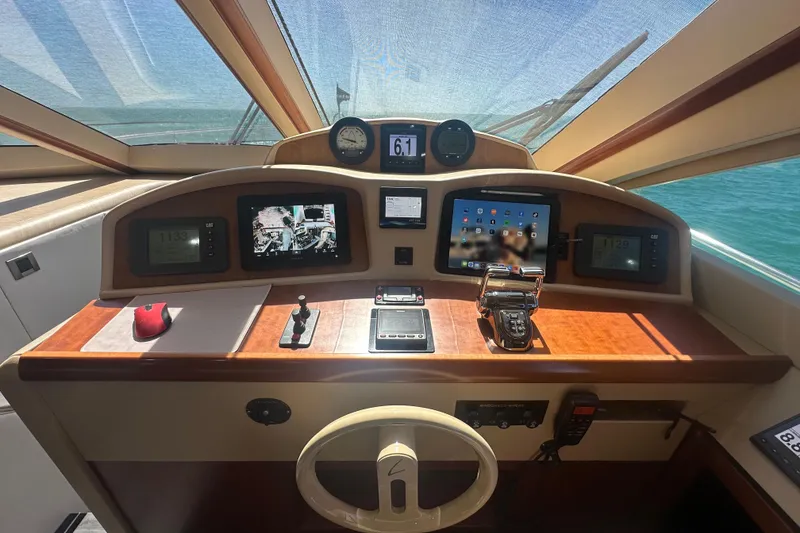 Slide: The Image of Helm of 2006 Lazzara 68 Motoryacht with navigation instruments and controls. - 37