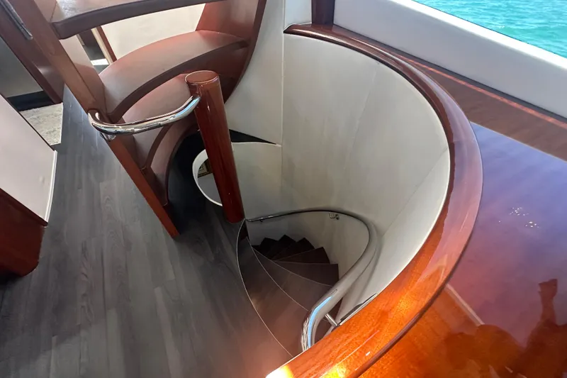 Slide: The Image of Elegant spiral staircase on 2006 Lazzara 68 Motoryacht with polished wood finish. - 46
