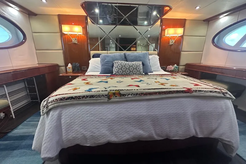 Slide: The Image of Luxurious bedroom interior of 2006 Lazzara 68 Motoryacht with elegant decor and plush bedding. - 48