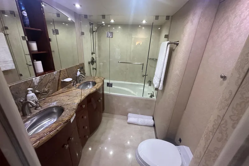 Slide: The Image of Luxurious bathroom in 2006 Lazzara 68 Motoryacht with dual sinks and glass-enclosed shower. - 50