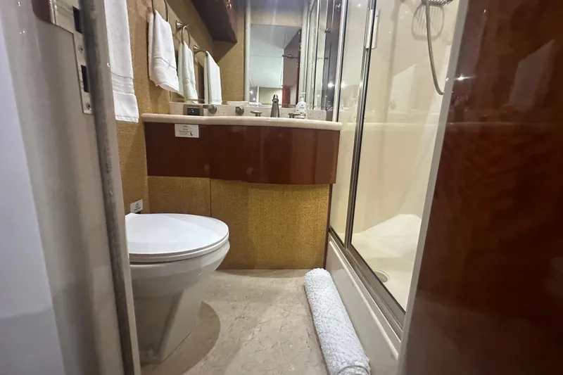 Slide: The Image of Luxurious bathroom in 2006 Lazzara 68 Motoryacht with modern fixtures and elegant design. - 56