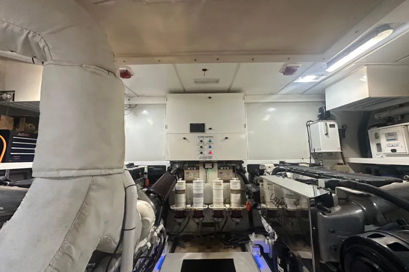Slide: The Image of Engine room of a 2006 Lazzara 68 Motoryacht, showcasing machinery and equipment. - 72