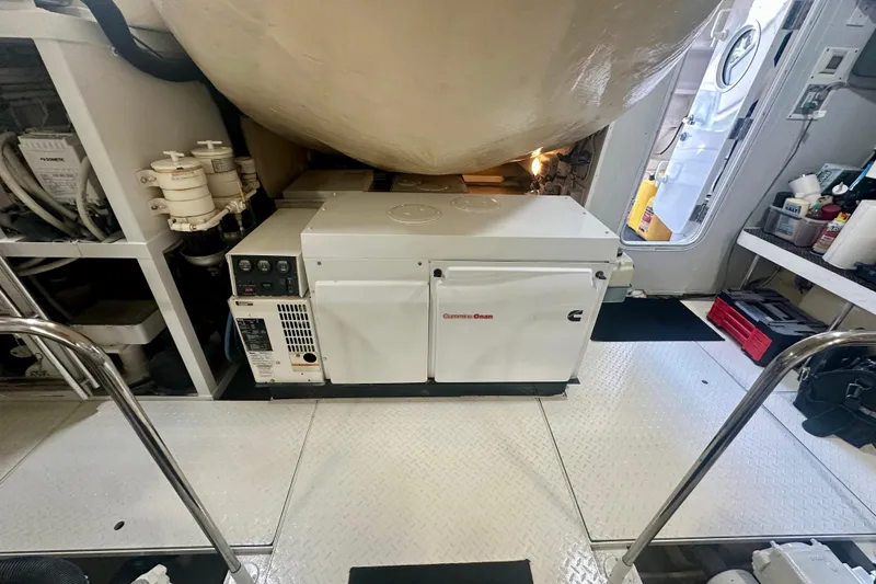 Slide: The Image of Engine room of 2006 Lazzara 68 Motoryacht featuring Cummins Onan generator. - 78