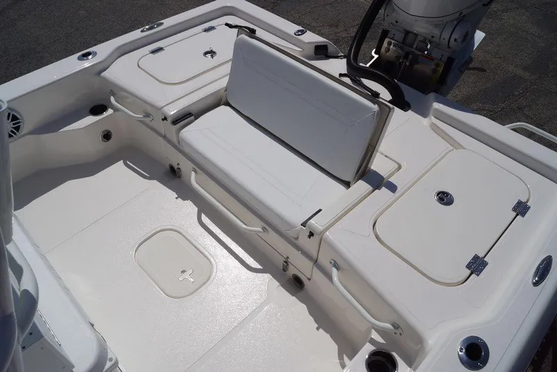 Slide: The Image of 2026 Skeeter SX241 boat interior with white seating and storage compartments. - 10