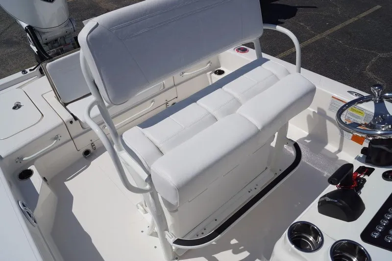 Slide: The Image of 2026 Skeeter SX241 boat interior with white seating and steering console. - 17