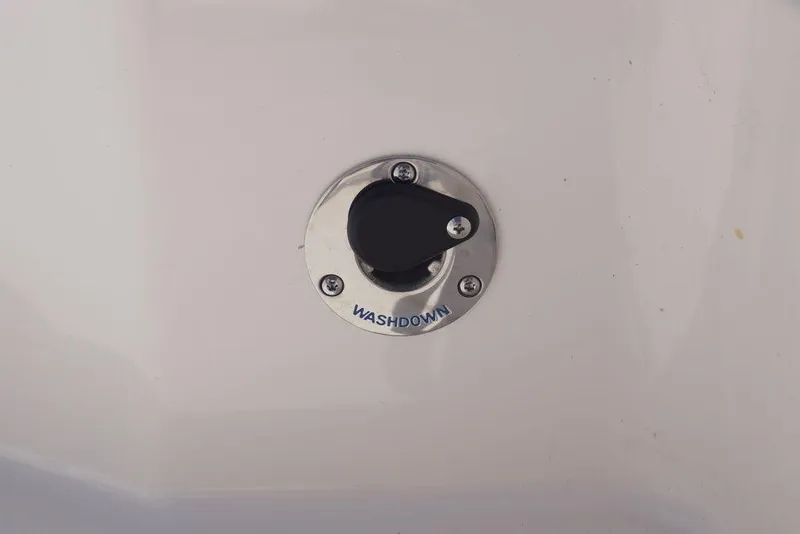 Slide: The Image of Washdown outlet on 2026 Skeeter SX241 boat, featuring a sleek metal finish. - 18