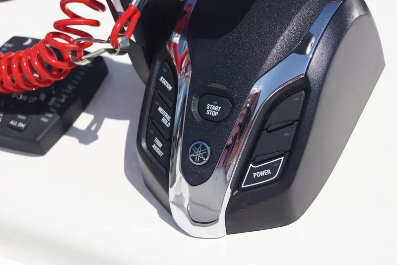 Slide: The Image of Control panel of 2026 Skeeter SX241 boat with start/stop and power buttons. - 20